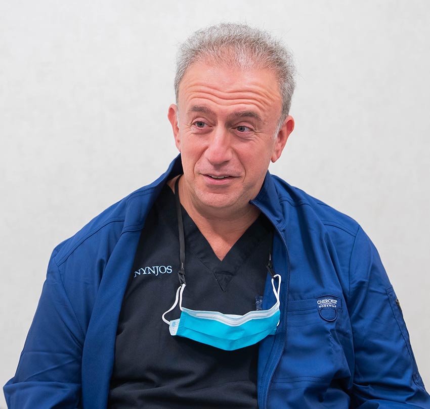 Dr. Paul R. Calat wearing scrubs
